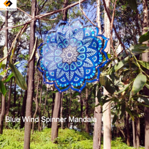 Blue mandala wind spinners metal sculpture hanging in a garden with vibrant colors.