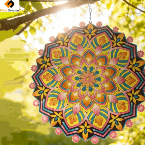 12in Mandala Wind Spinner hanging in a garden among flowers, enhancing garden decoration