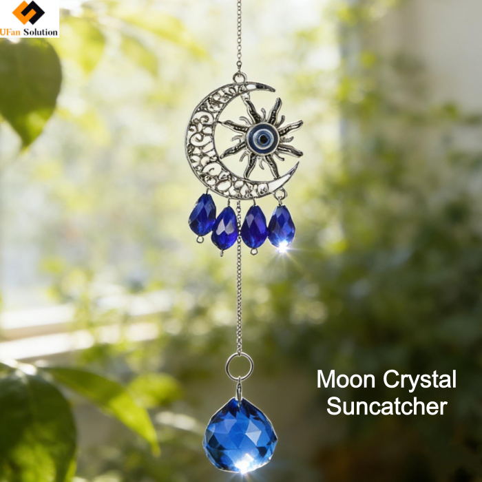 Moon Crystal Suncatcher hanging in a sunlit window, showcasing blue crystal prisms and evil’s eye design for wholesale retail