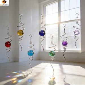 Colorful Crystal Glass Orb Pendant hanging in a bright window, refracting rainbow light patterns indoors.