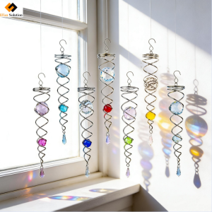 UFan Solution Gazing Ball Spiral Tail Wind Spinner - Seven colorful units hanging by a sunny window creating light reflections.