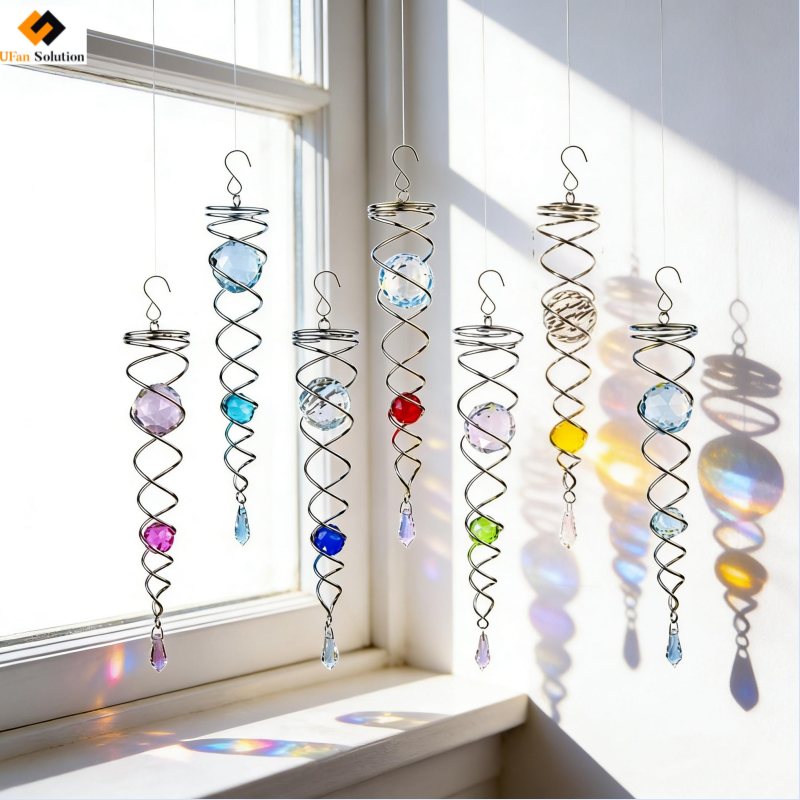 UFan Solution Gazing Ball Spiral Tail Wind Spinner - Seven colorful units hanging by a sunny window creating light reflections.