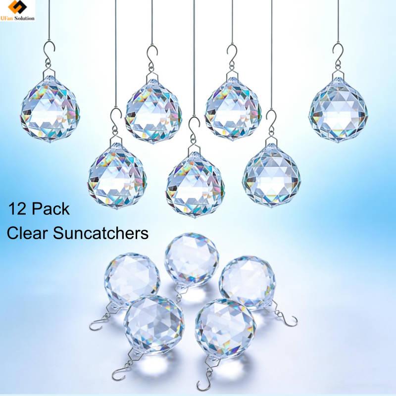 Pack of 12 clear crystal prism suncatchers, faceted balls hanging on metal hooks, designed to catch sunlight and create rainbow light effects in home decoration.