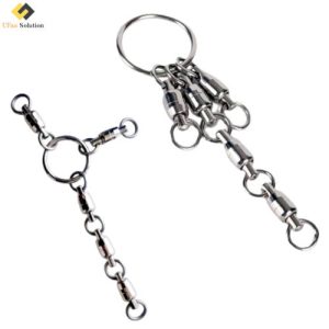 A collection of polished stainless steel 5 in 1 Dual-Bearing Swivels connected together and attached to a key ring, demonstrating their assembly and compact design.