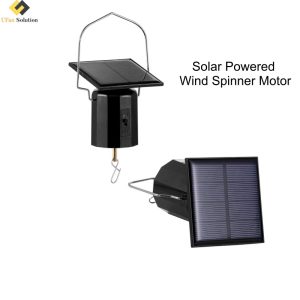 A black solar powered wind spinner motor with solar panel, shown activating decorative spinners in an outdoor setting.