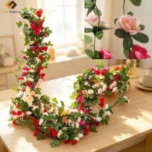 Lifestyle photo of a 2.5m 40-head best Artificial Fake Silk Peony Flower Garland with red, pink, white and light yellow blooms and green leaves styled on an indoor wooden table by a sunny window, with close-up insets of the flowers and foliage.