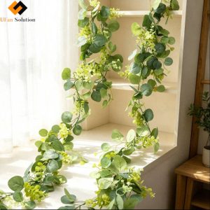 Artificial Eucalyptus & Hydrangea Garland draped over a sunlit window seat and built-in shelf, showing a layered, natural look for interior styling.